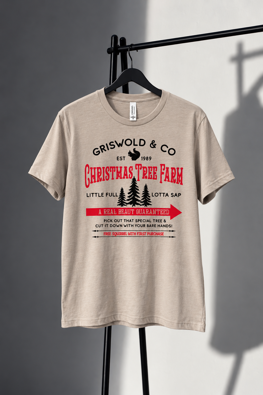 Neutral Bella Canvas Griswold and Co Christmas Tree Farm tee with red and black screen print