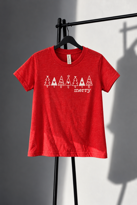 Red Bella Canvas youth tee with seven white Christmas trees and merry lettering