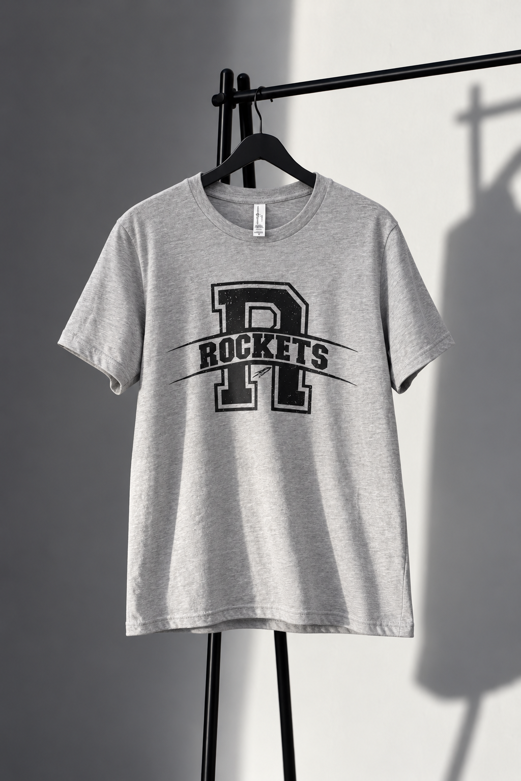 Gray Bella Canvas tee with distressed black varsity R and Rockets screen print