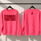 Neon pink Stronger Together sweatshirt front with straight lettering and back awareness ribbon